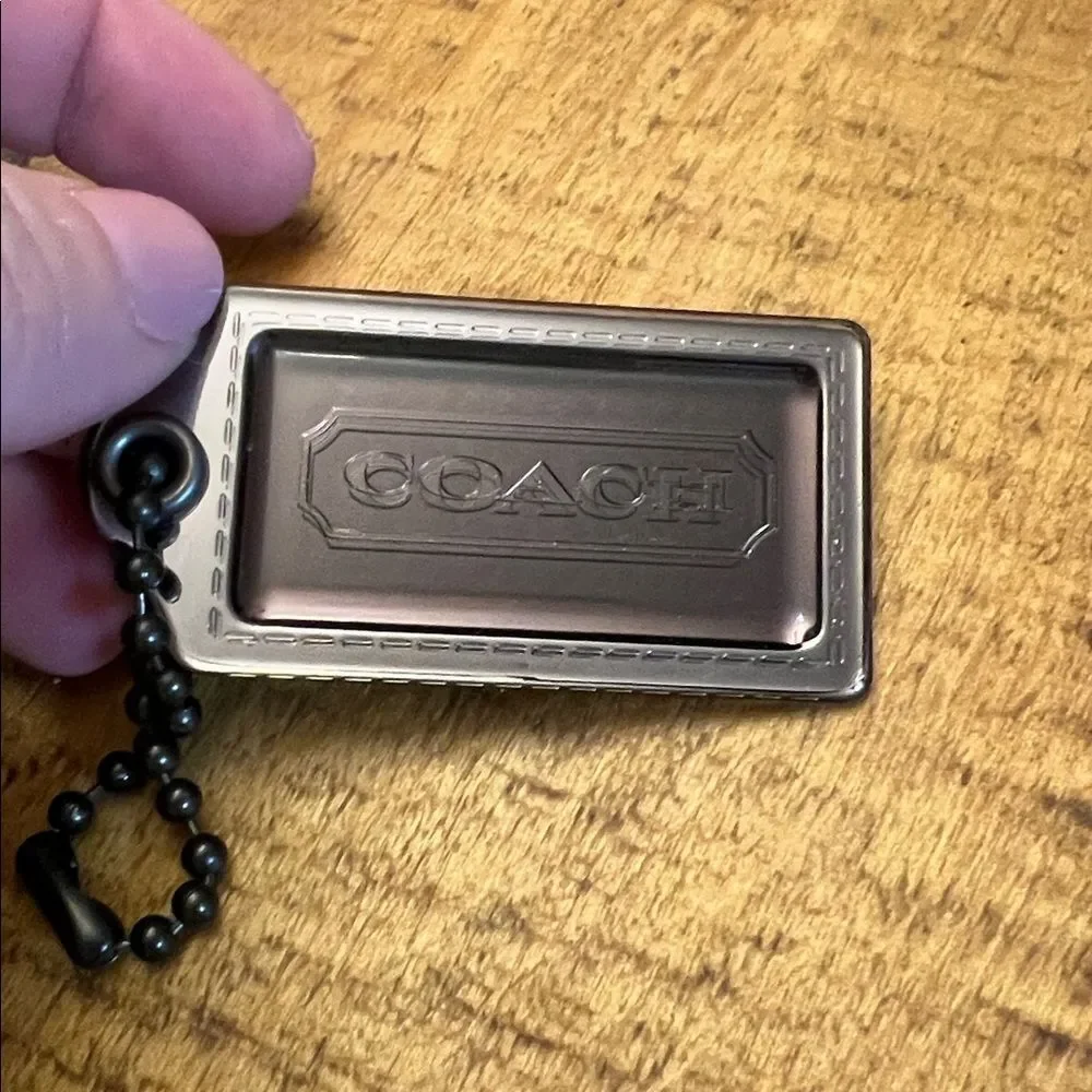 Coach Poppy plastic hangtag smoky gray with chunky ballchain
